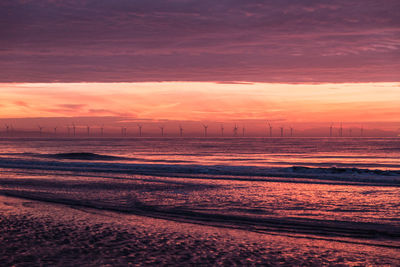 Scenic view of sea against dramatic sky