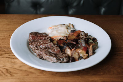 High angle view of meat in plate on table