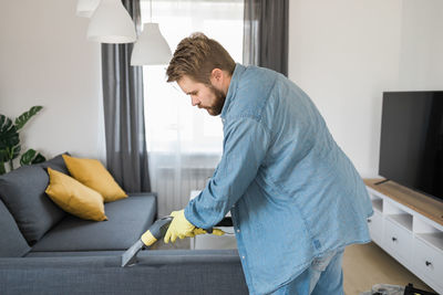 Side view of man working at home