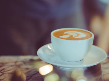 Close-up of coffee cup on table