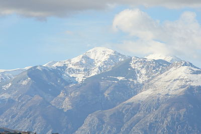 Scenic view of snowcapped mountains against sky