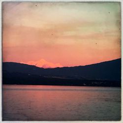 Scenic view of lake at sunset