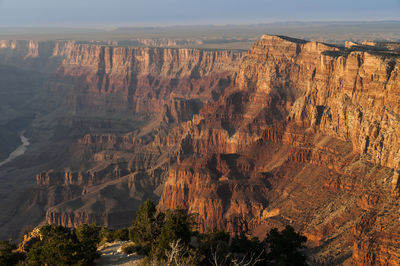 Scenic view of rocky mountains on sunny day