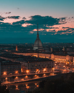 Illuminated buildings in city at night