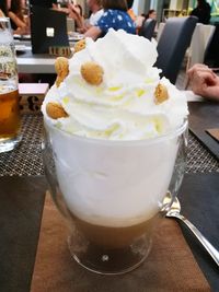 Close-up of ice cream in glass on table