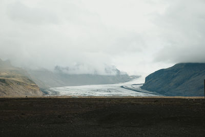 Scenic view of landscape against sky during winter