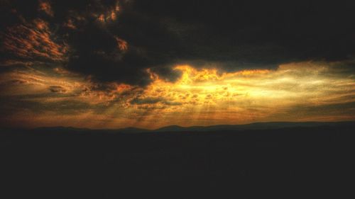 Scenic view of cloudy sky at sunset