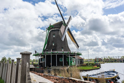 Traditional windmill against sky