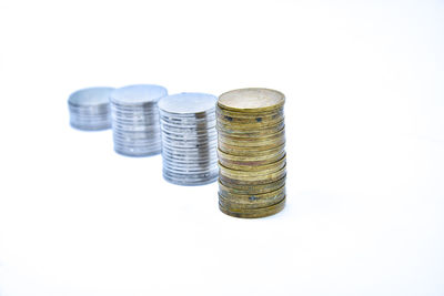 Close-up of stack of objects against white background