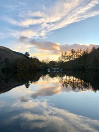 Scenic view of lake against sky during sunset