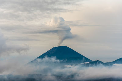 Scenic view of volcanic mountain against sky