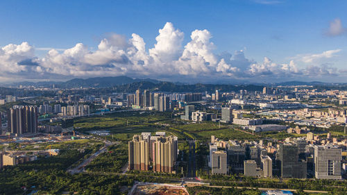 High angle view of buildings in city against sky