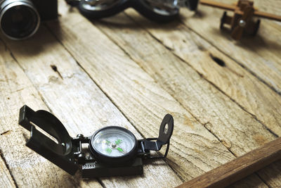 Close-up of navigational compass on table