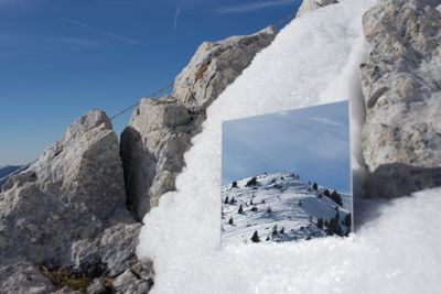 Scenic view of sea against sky during winter