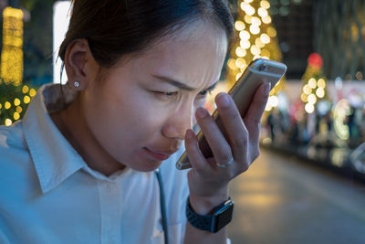 Portrait of teenage girl using mobile phone