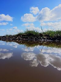 Scenic view of landscape against cloudy sky