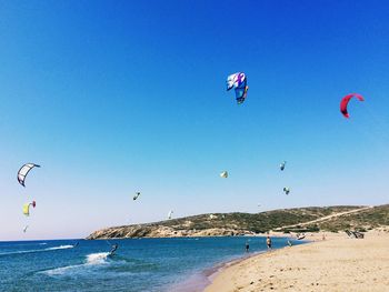 People flying over beach