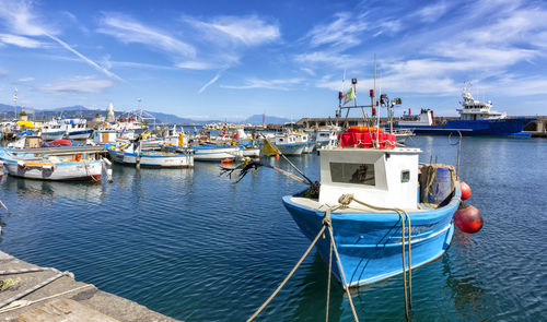 Boats moored at harbor