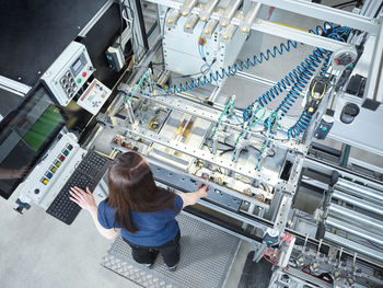 Young technician working at factory