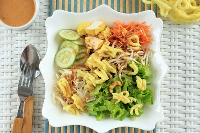 Asinan betawi. indonesian raw vegetable and yellow tofu bean curd with tangy peanut dressing