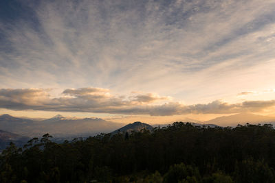 Scenic view of mountains against sky at sunset