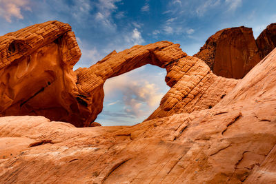 Low angle view of rock formations against sky