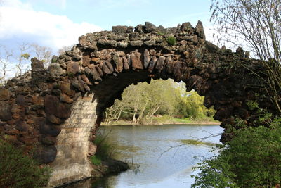 Low angle view of rock formation against sky