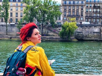 Portrait of woman looking at canal