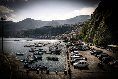 High angle view of boats moored at shore against sky