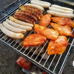 High angle view of meat on barbecue grill