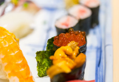 Close-up of multi colored candies in plate on table