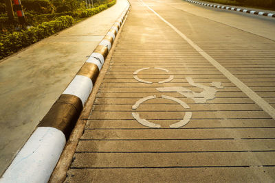 High angle view of arrow symbol on road