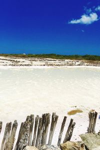 Scenic view of sea against blue sky