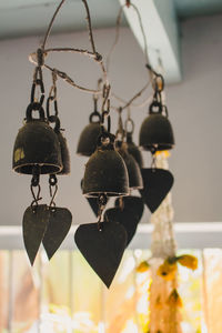 Close-up of lighting equipment hanging against wall