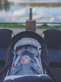 Full length of boy lying on seat