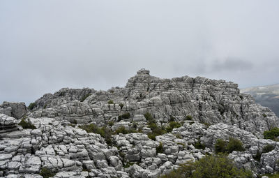 Rock formations on mountain against sky