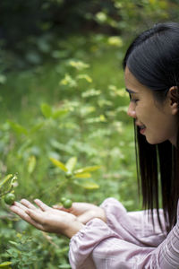 Side view of young woman looking away