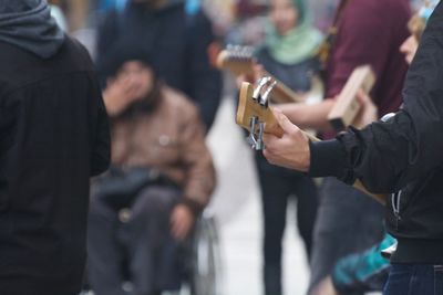 Musician playing guitar on street