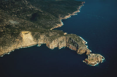 High angle view of rock formation in sea