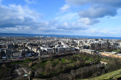 City skyline view from top of a tower. sea and sky meeting point.  various buildings in the view 