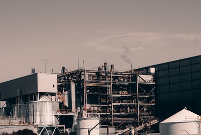 Low angle view of factory against sky