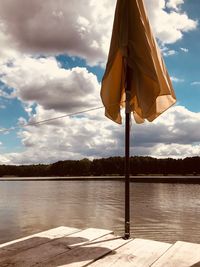 Pier over lake against sky