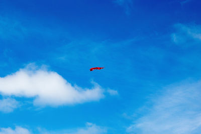 Low angle view of helicopter against sky