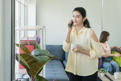 Young woman using mobile phone