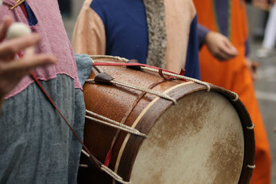 Midsection of people playing music