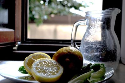 Close-up of fruits in glass jar on table