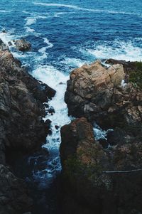 High angle view of rock formation in sea