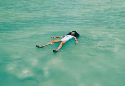 High angle view of woman swimming in pool