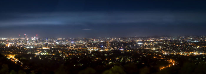 Aerial view of illuminated cityscape at night