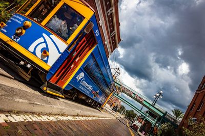 Low angle view of road against cloudy sky